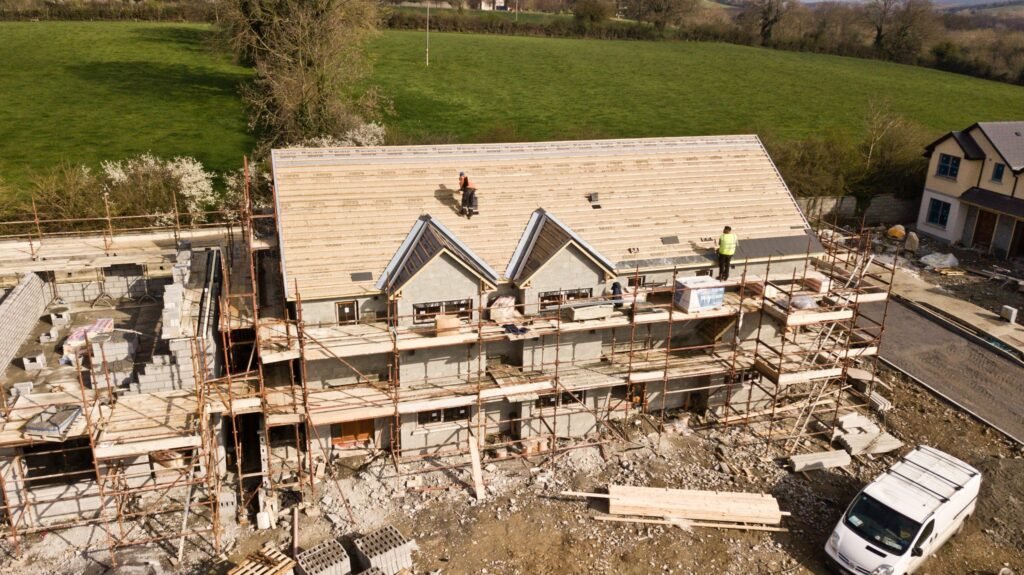 Illustrative construction site with scaffolding and roof work