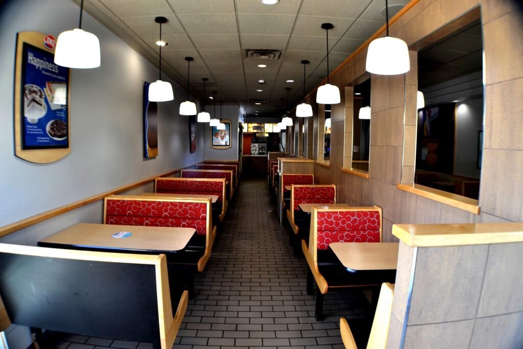 Dairy Queen dining area with red booths and pendant lighting