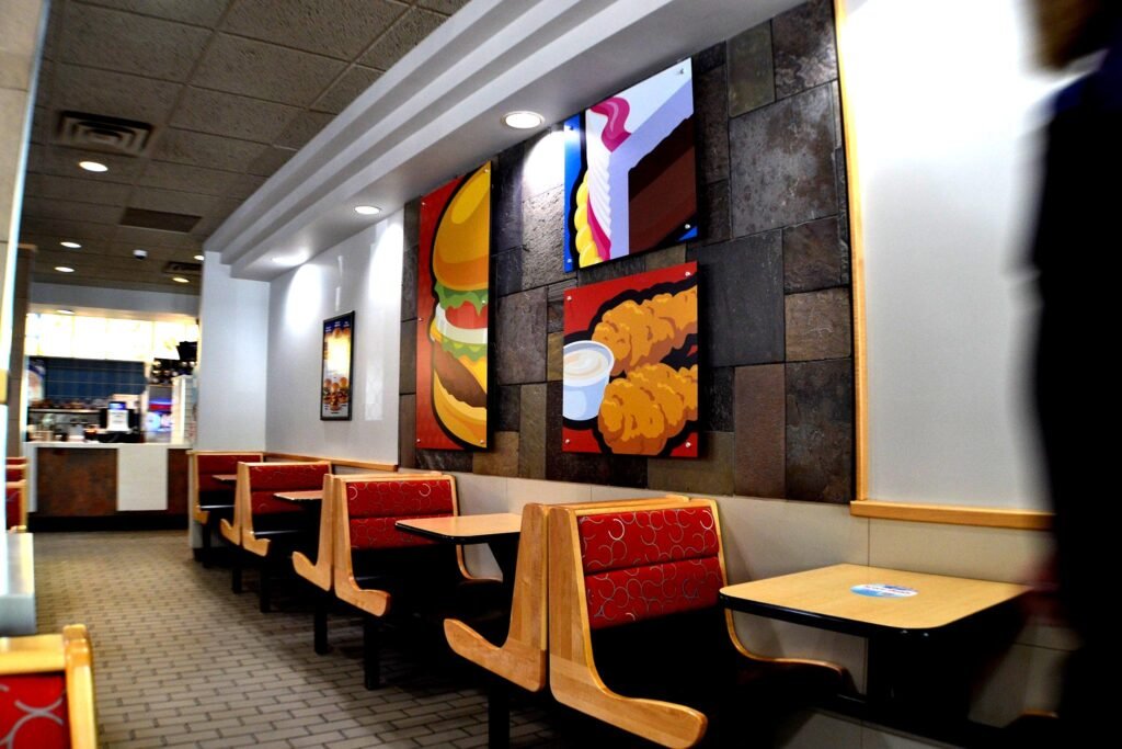 Dairy Queen seating beside a tiled feature wall